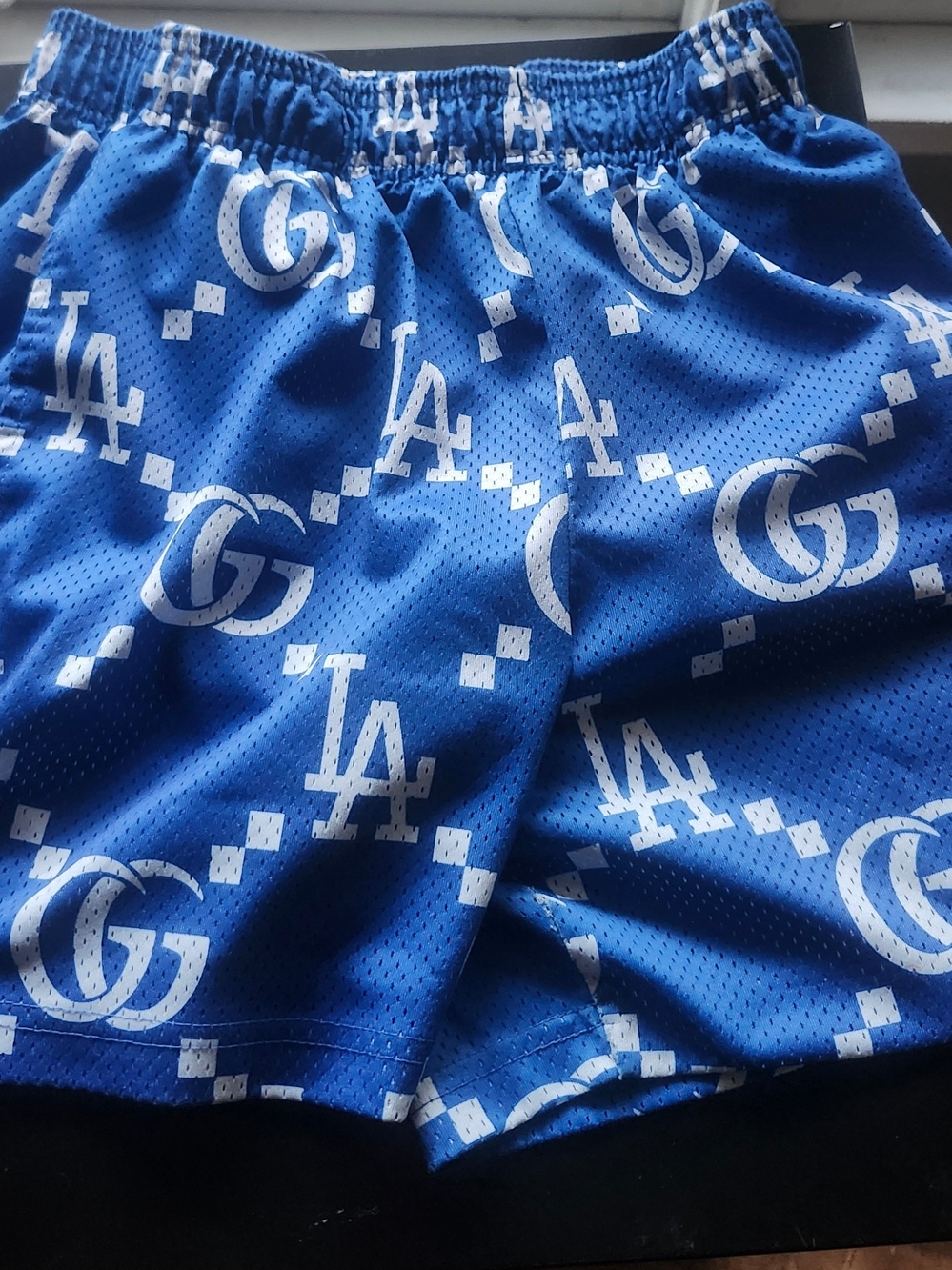Bravest Studio Blue Shorts with White Logo Pattern